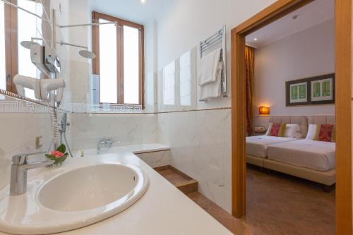 En eller flere senge i et værelse på Hotel Milton Roma