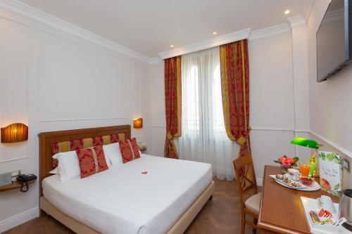 En eller flere senge i et værelse på Hotel Milton Roma