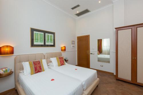 En eller flere senge i et værelse på Hotel Milton Roma