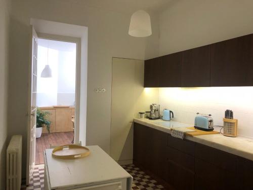 a kitchen with a sink and a counter top at Rua Tenente Campos Rego, Ground Floor in Coimbra
