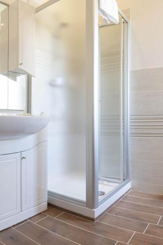 a bathroom with a shower and a sink at Alba sul Mare Guest House in Massignano