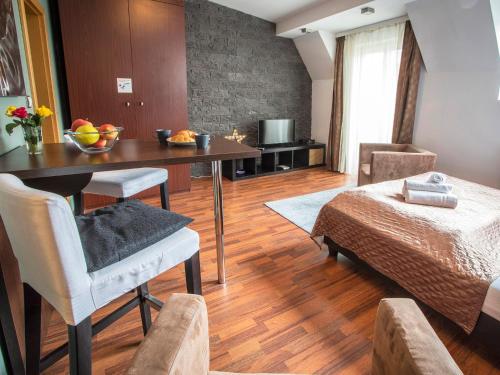 a living room filled with furniture and a table at Apartments City Centre in Bratislava