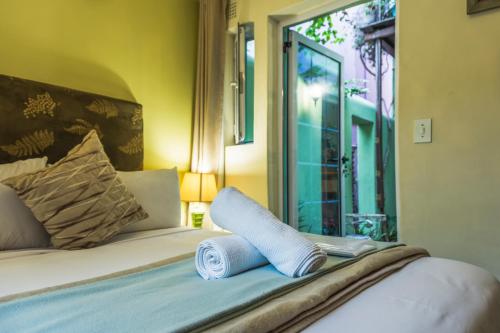 Ένα ή περισσότερα κρεβάτια σε δωμάτιο στο La Rose B&B