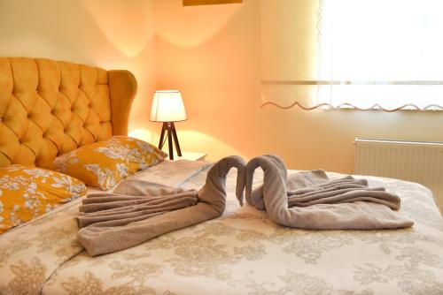 a pair of towels on top of a bed at seasidehouse in Ordu