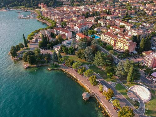 an aerial view of a city next to the water at Regina Adelaide Hotel & SPA in Garda