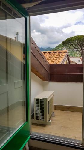 an open window with a air conditioner on a balcony at Duomo Attic (rooms) in Ravello
