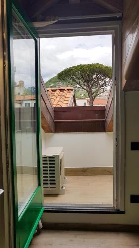 a sliding glass door with a view of a window at Duomo Attic (rooms) in Ravello