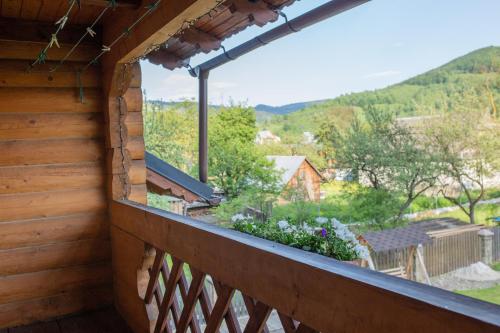 a balcony with a view of the mountains at Lucy in Yaremche