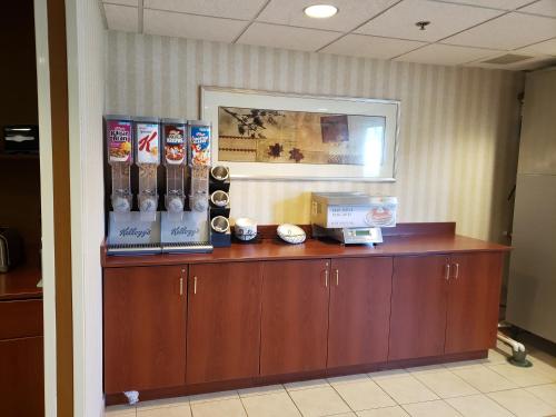 a reception desk in a office with aperature at Microtel Inn & Suites by Wyndham Dover New Hampshire in Dover