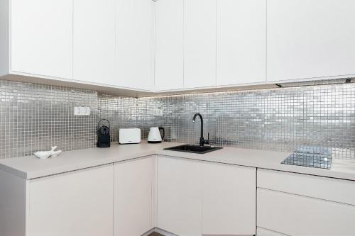 Η κουζίνα ή μικρή κουζίνα στο Apartamenty The View Gardenia