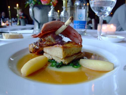 a white plate of food on a white table at The Witchery by the Castle in Edinburgh
