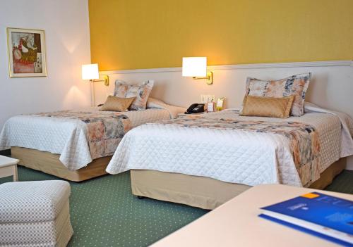 Ένα ή περισσότερα κρεβάτια σε δωμάτιο στο Hotel Europa