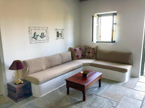a living room with a couch and a table at Emelia in Otzias