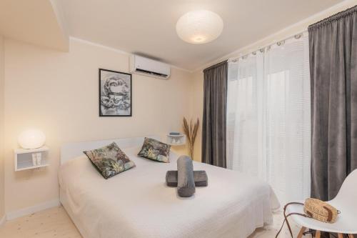 Una cama o camas en una habitación de Moa Casa