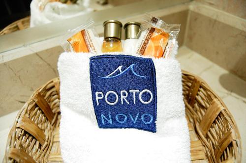 a basket filled with towels and bottles of soap at Hotel Porto Novo in Veracruz