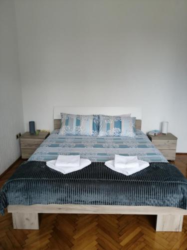 a bedroom with a bed with two towels on it at Apartman studio Katarina in Golubac