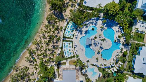 an aerial view of the beach and the pool at the resort at Senator Puerto Plata in San Felipe de Puerto Plata