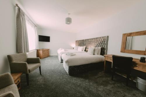 En eller flere senge i et værelse på Owners Residence