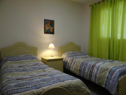 Katil atau katil-katil dalam bilik di Sierras de La Punta
