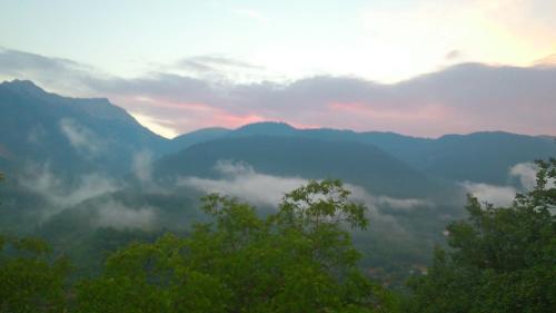a view of a valley with trees and mountains at Levanta in Méga Khoríon
