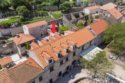 an overhead view of a building with orange roofs at Emily Apartment in Suđurađ
