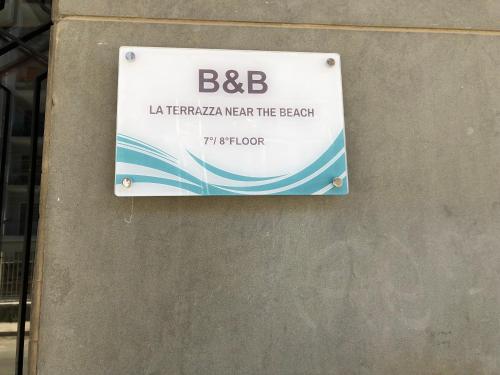a sign on the side of a building at B&B La Terrazza Near The Beach in Bari