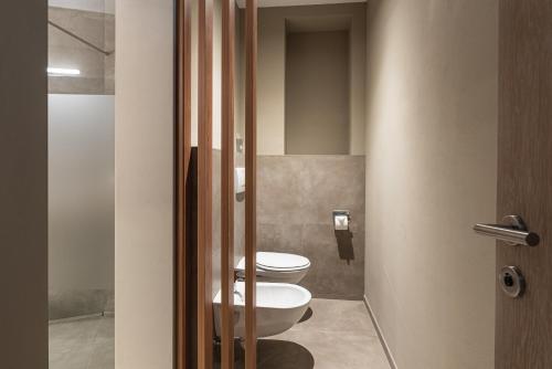a bathroom with two toilets in a room at Residenz Feldmühle unterhalb der Burg Taufers in Campo Tures