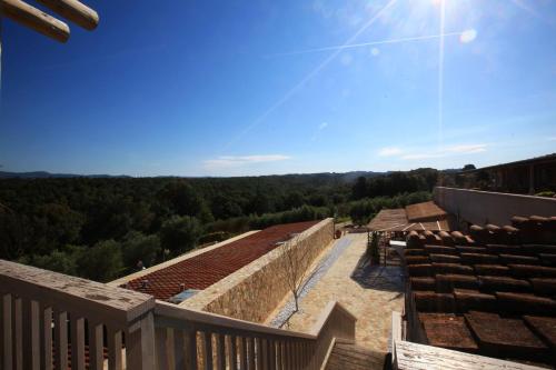 a view from the balcony of a house with a view of the forest at MORF suites in Casale Marittimo