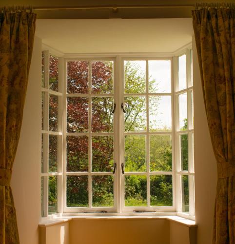 an open window with a view of trees at Pontyclerc Farm House Bed and Breakfast in Ammanford