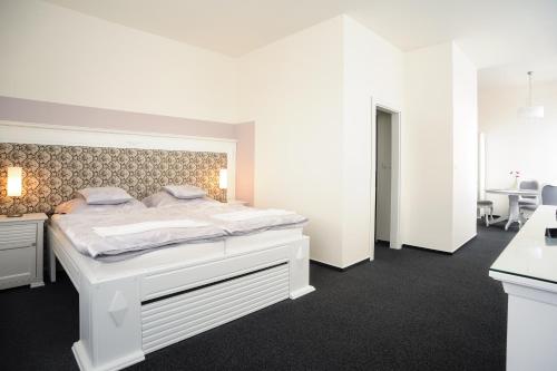 Postel nebo postele na pokoji v ubytování Hotel Steiger