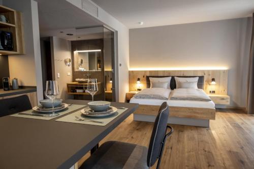 Ένα ή περισσότερα κρεβάτια σε δωμάτιο στο AKZENT Hotel Laupheimer Hof