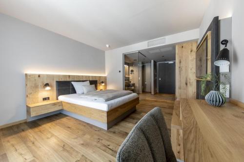 Ένα ή περισσότερα κρεβάτια σε δωμάτιο στο AKZENT Hotel Laupheimer Hof