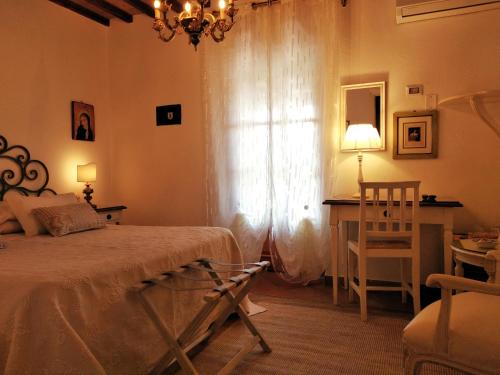 Cama o camas de una habitación en Mulino Di Quercegrossa