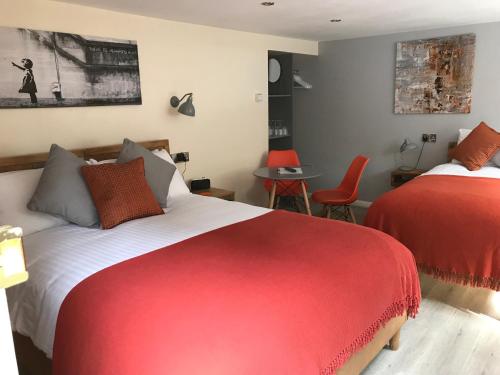 A bed or beds in a room at Willow Down 