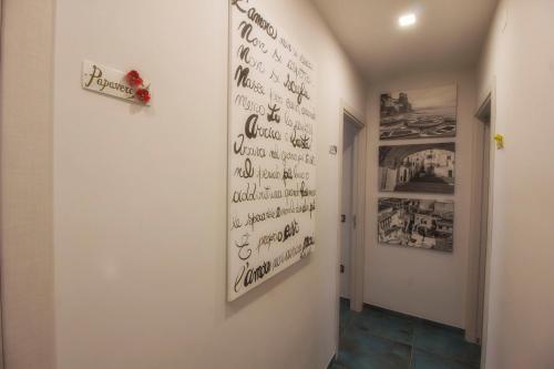 a hallway with a wall with writing on the wall at B&B Carol in Cetara