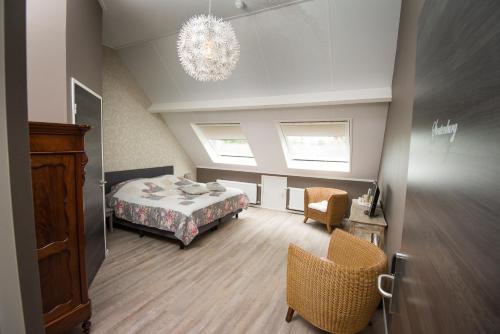 Ένα ή περισσότερα κρεβάτια σε δωμάτιο στο B&B Groot Pepersgoed