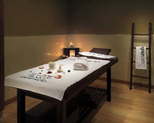 a table in a room with a laptop on it at H10 Salauris Palace in Salou