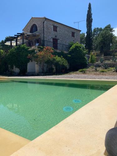 a large pool of water in front of a house at Villa Melite in Agios Nikolaos