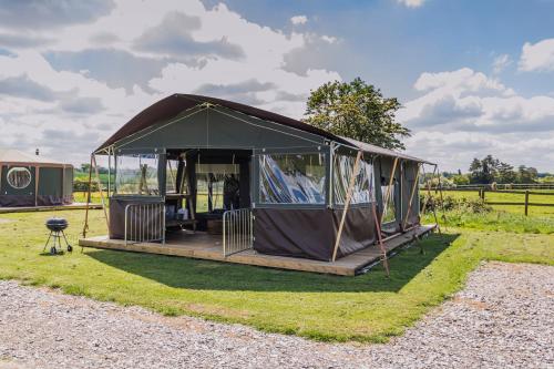 a gazebo in a field of grass at Mousley House Farm Campsite and Glamping in Warwick