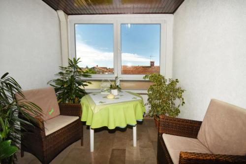Zona de estar de Apartments and Rooms Branka