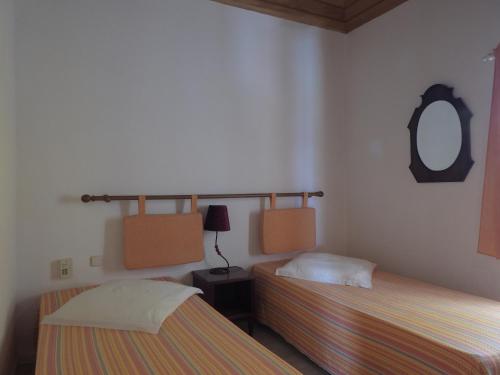 Una cama o camas en una habitación de Foya Branca by Flagworld Hotels
