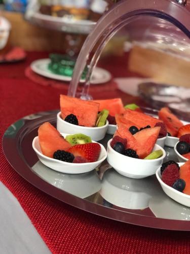 a tray filled with fruit on a table at Hotel Ascot in Caianello