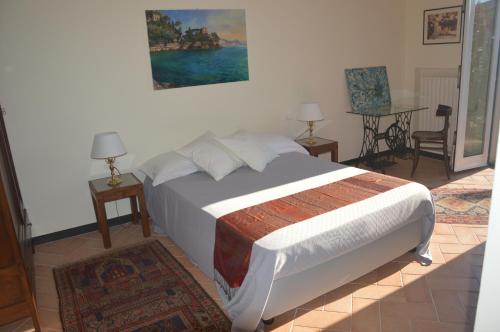 Letto o letti in una camera di Villa Albachiara