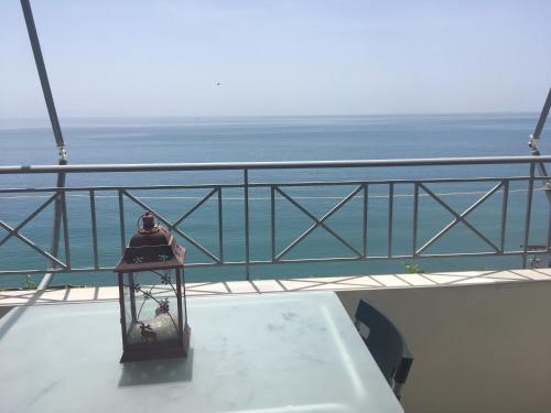 a view of the ocean from the balcony of a ship at Qeparo Antonio Rooms in Qeparo