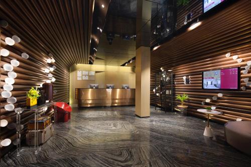 TV a/nebo společenská místnost v ubytování Paco Hotel Guangzhou Jiangtai Road Metro Branch