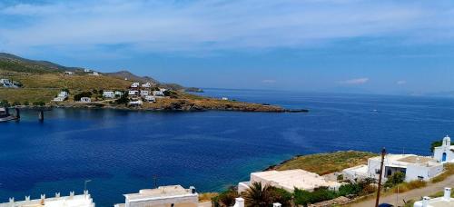 a view of a large body of water with buildings at Fantastic View Studios Kythnos in Kithnos