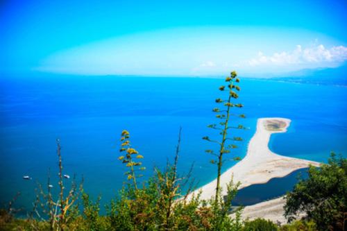 a view of the ocean from the top of a mountain at Sea Elegance in Oliveri