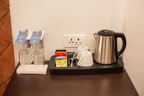 a counter with a coffee maker on a table at Chandragiri Hills Resort Kathmandu-Luxury in the Clouds in Thānkot