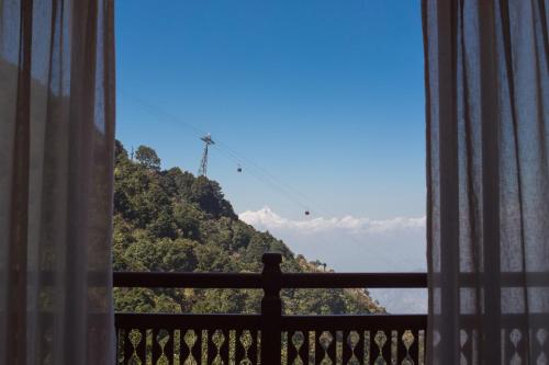 a view of a mountain from a window at Chandragiri Hills Resort Kathmandu-Luxury in the Clouds in Thānkot