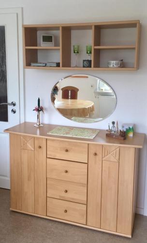 a dressing table with a mirror on top of it at Ferienhaus am Rennsteig in Schmiedefeld am Rennsteig
